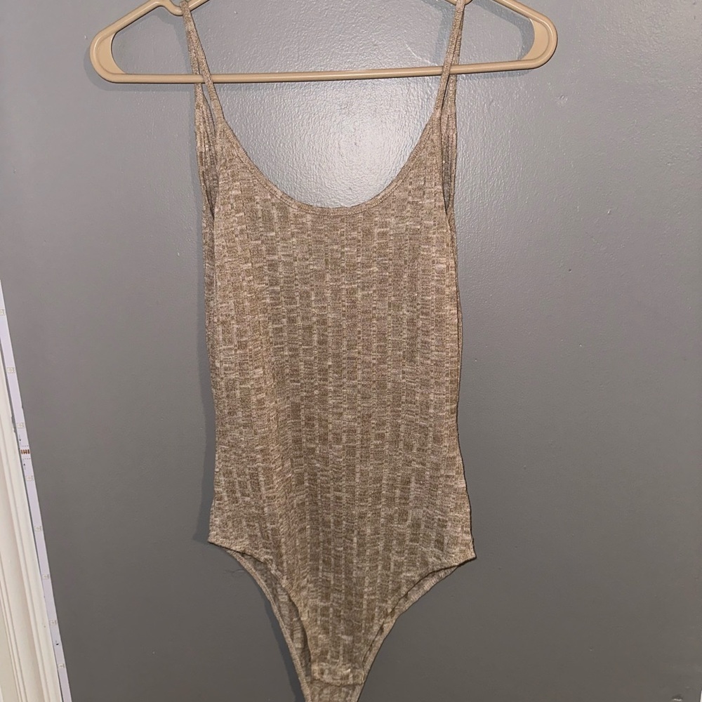 Women’s one piece with open back in size small.